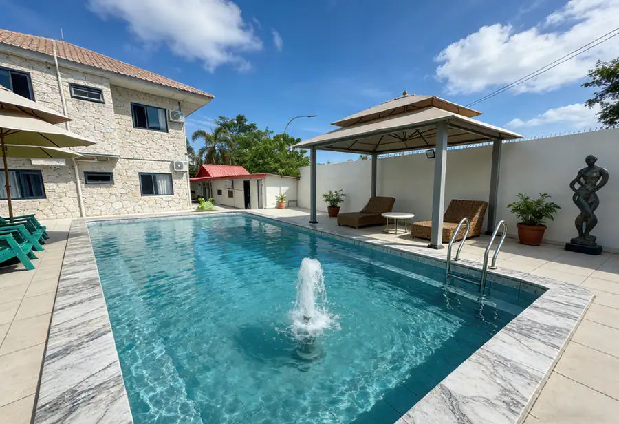 Outdoor swimming pool area with lounge chairs Anyu Pool Villa Resort